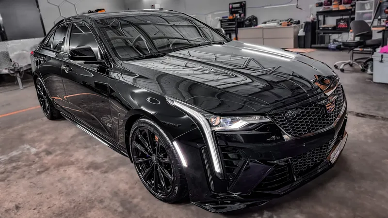 Black Cadillac CT4-V Blackwing with flawless paint and mirror reflections after correction and ceramic coating