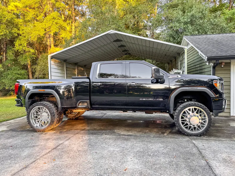 Black GMC Sierra Denali HD dually with polished wheels after a full detail