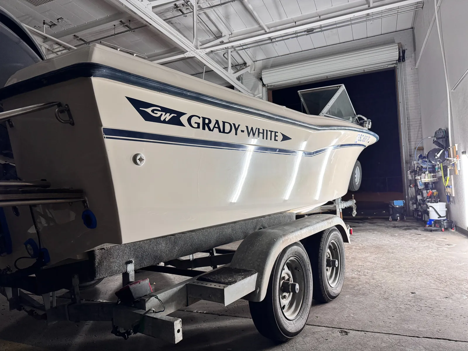Cream Grady-White fishing boat hull with a high-gloss finish after polish and protection, the kind of center console run out of Murrells Inlet SC