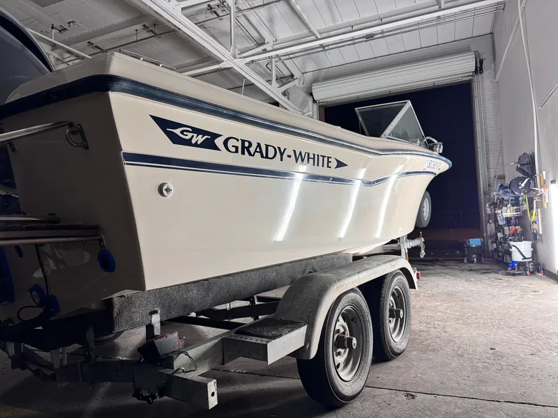 Cream Grady-White hull after a polish and wax