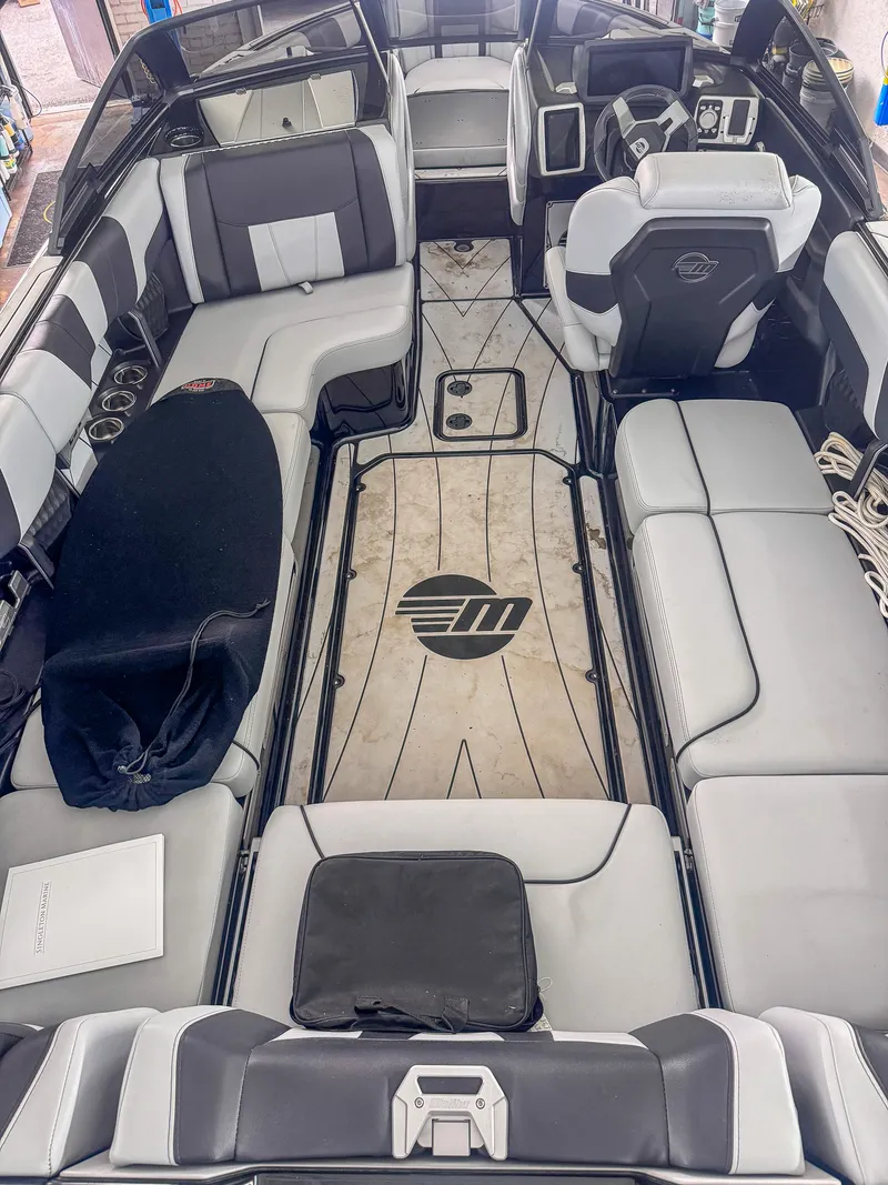 Before — Malibu Wakesetter cockpit deep clean — floor and seating