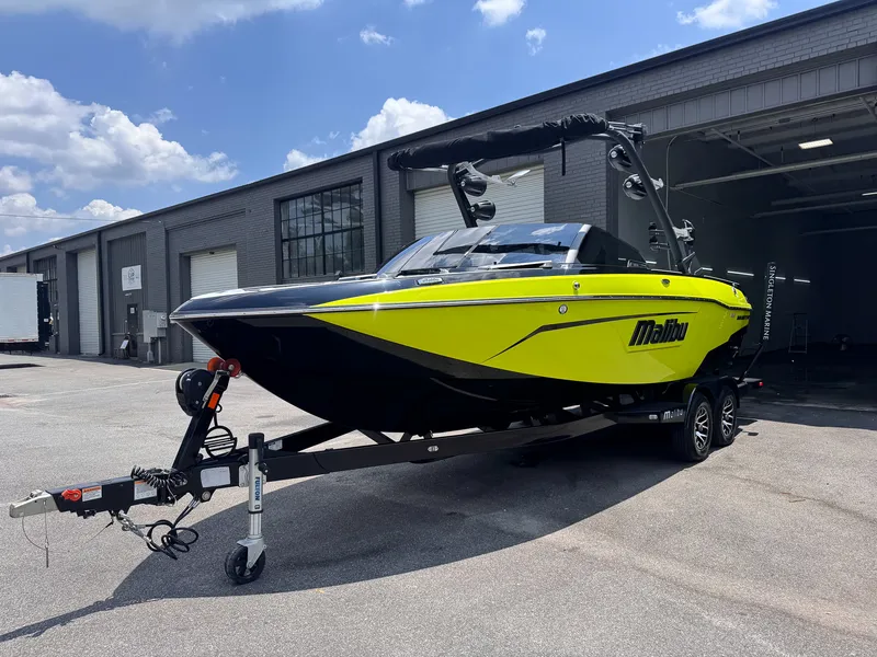 Black-and-yellow Malibu Wakesetter with glossy hull after an exterior detail