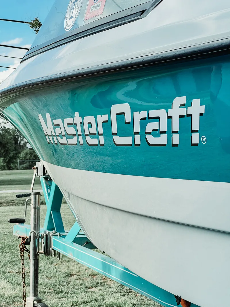 Teal vintage MasterCraft ProStar with restored high-gloss gelcoat after oxidation removal