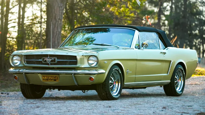 Restored lime-gold 1965 Ford Mustang convertible after a full detail and polish