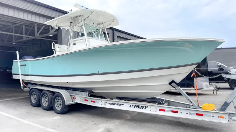 Seafoam-green 29-foot Regulator center console with high-gloss hull after correction and marine ceramic coating